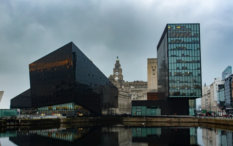 a large city with some buildings reflected in the water