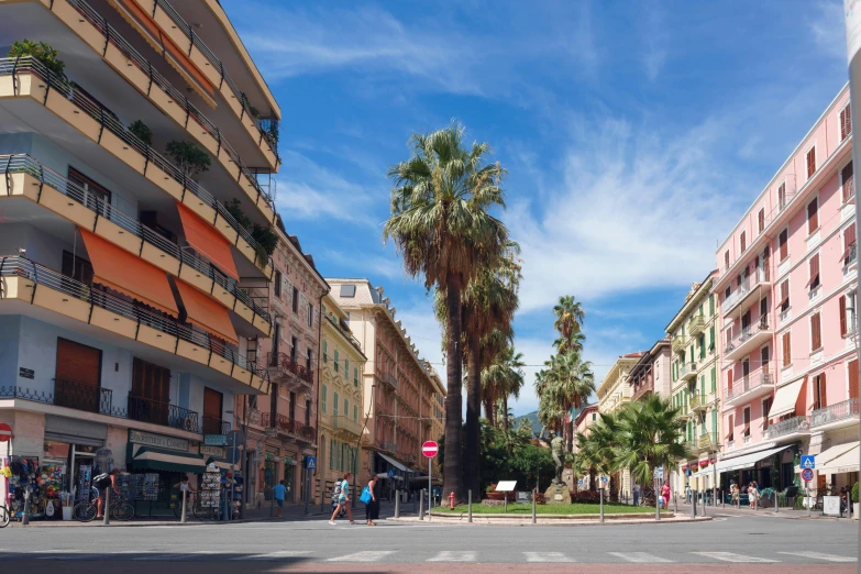 an empty street with cars and pedestrians walking