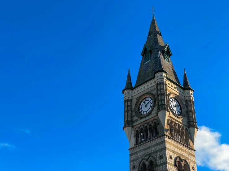 large stone tower with two clocks on both sides