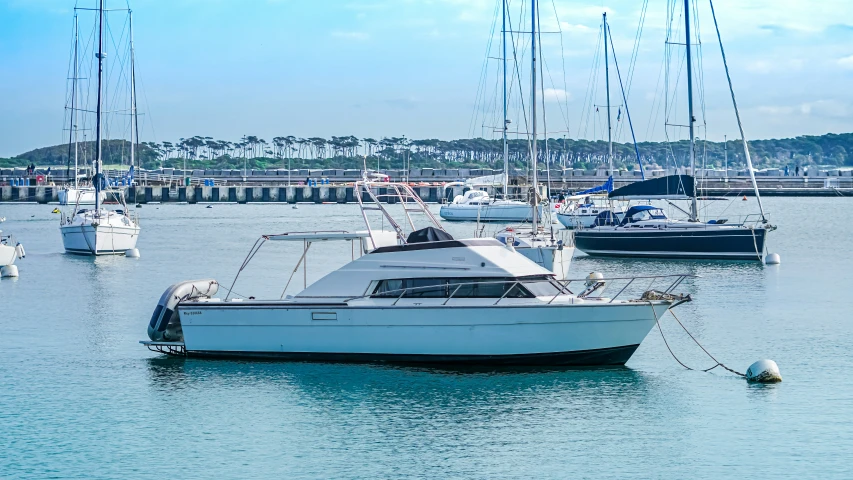 a harbor filled with lots of boats and anchored on the water