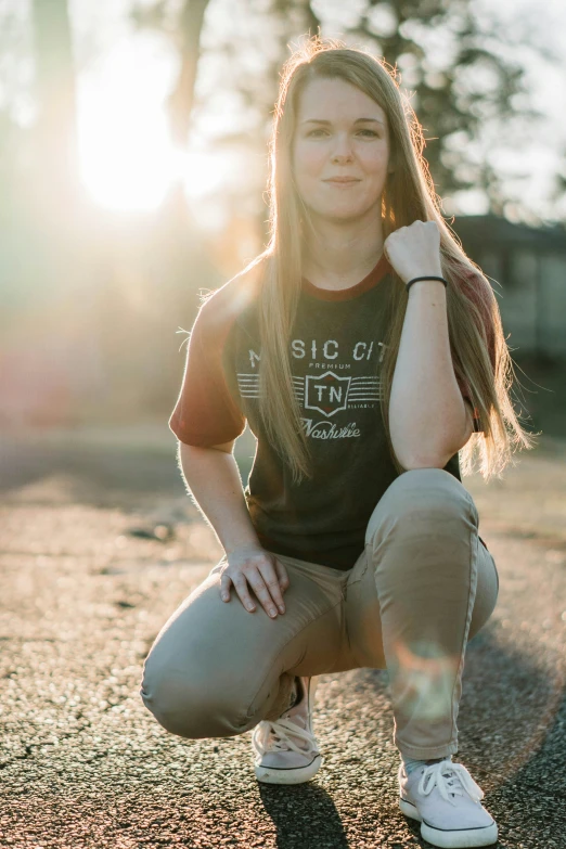 a teenaged girl poses for the camera