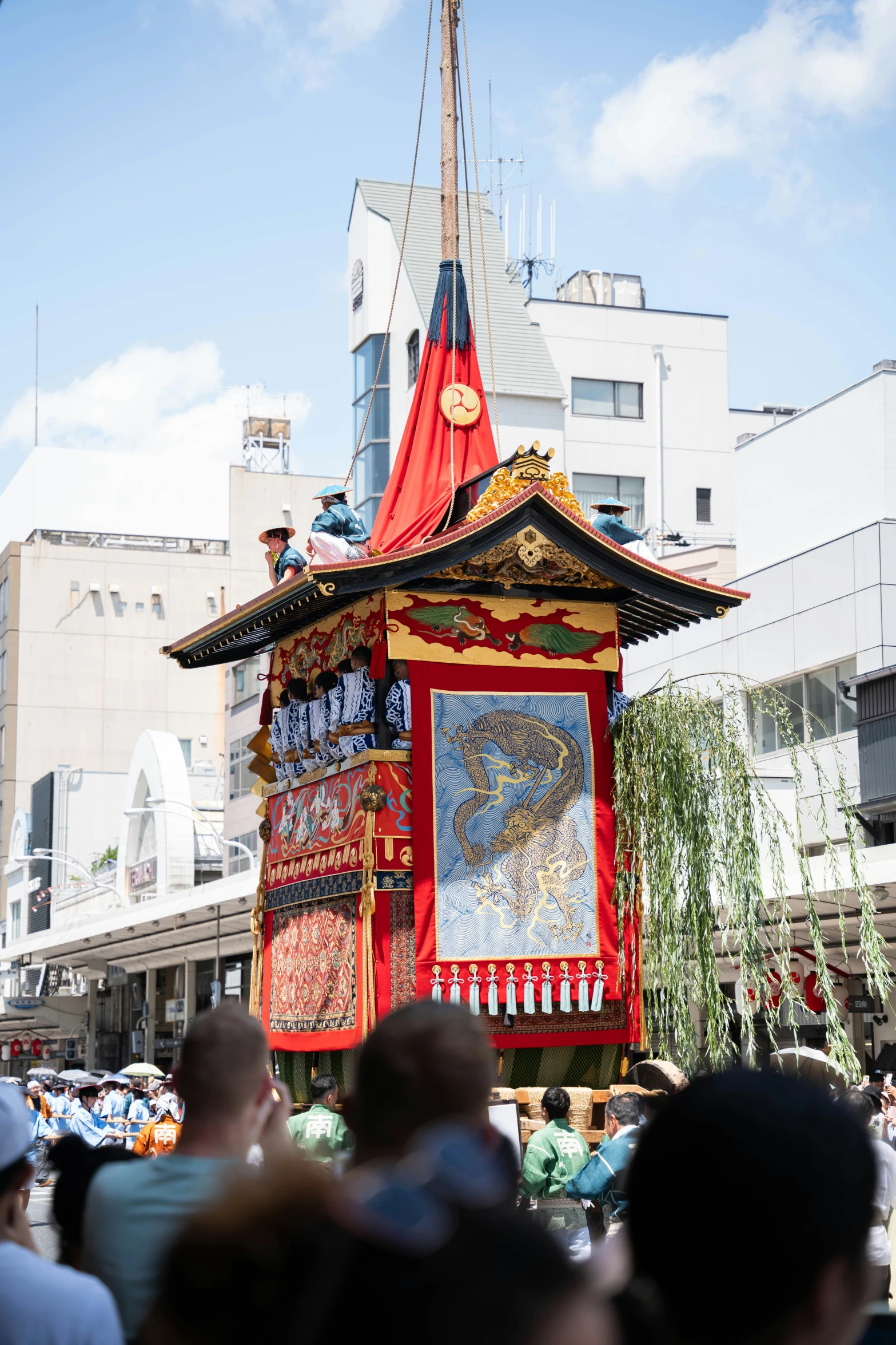 an oriental display at a parade with people