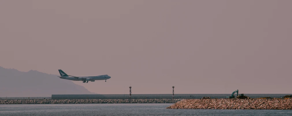 an airplane taking off from the runway at the airport