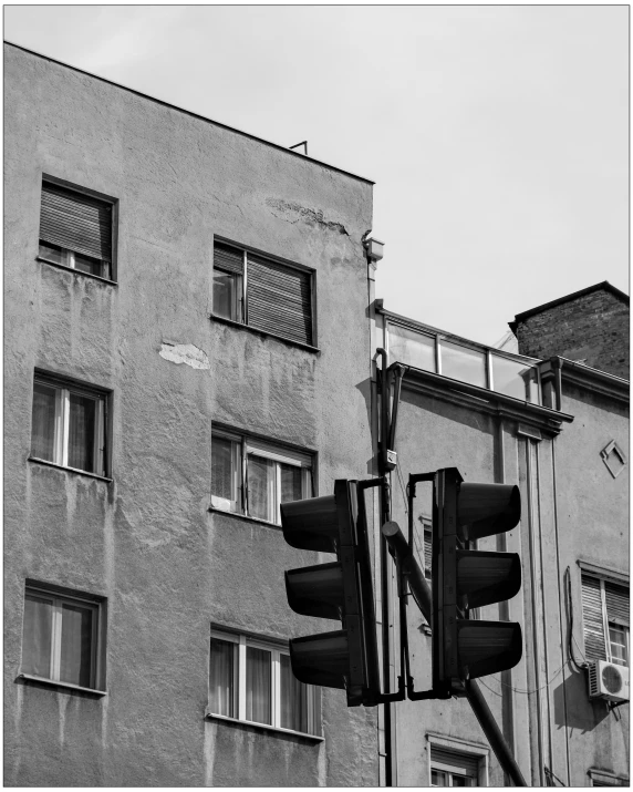 street sign in front of a tall building