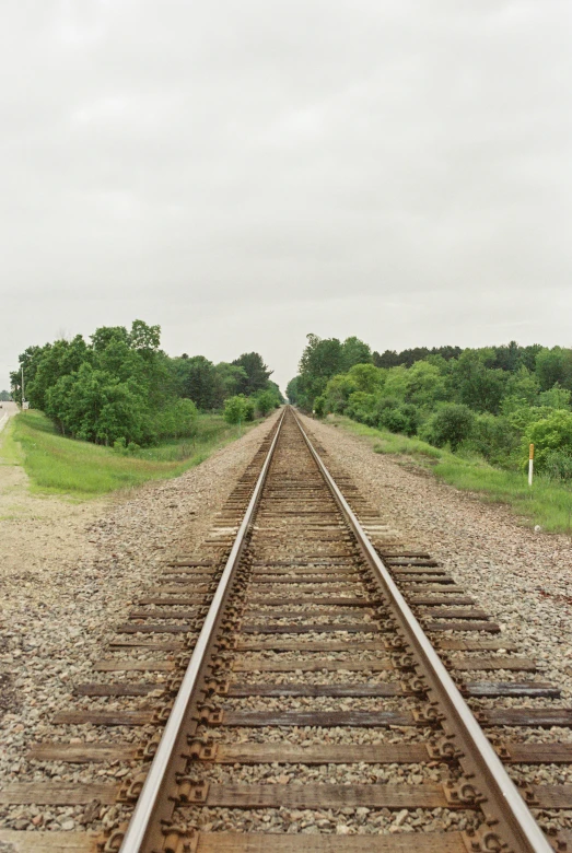 the tracks are empty on the side of the field