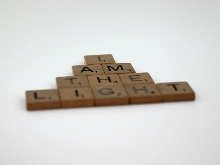 wooden scrabble type letters spelling i am the light