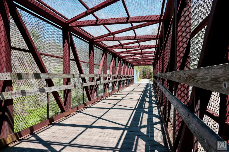 the long and wide walkway in the small town is made of brick