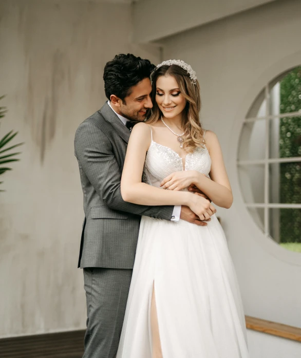 the groom and bride emce as they stand near each other