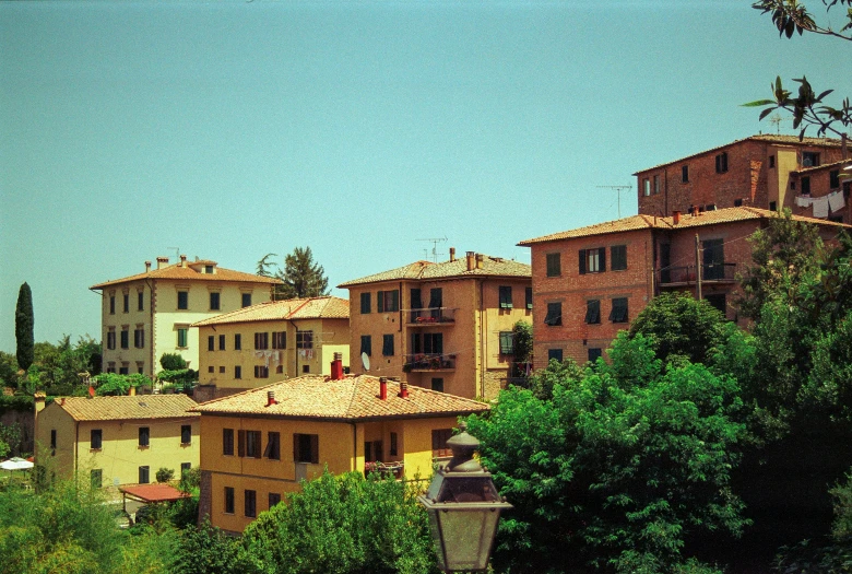 a group of houses sit on a hill