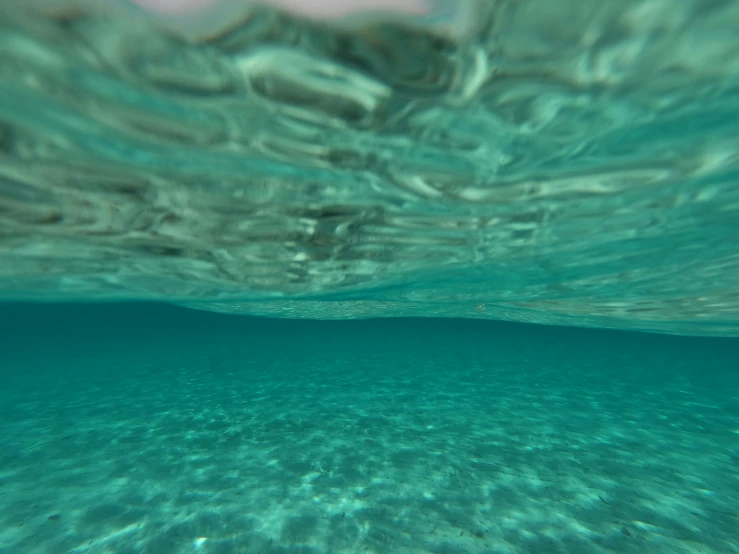 water bubbles are shown under the surface of the water