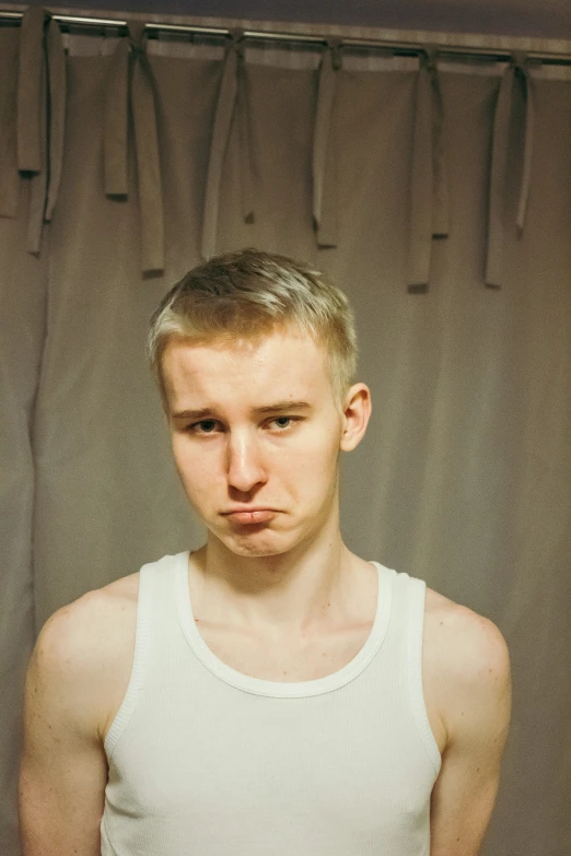 a man stands in front of a shower curtain