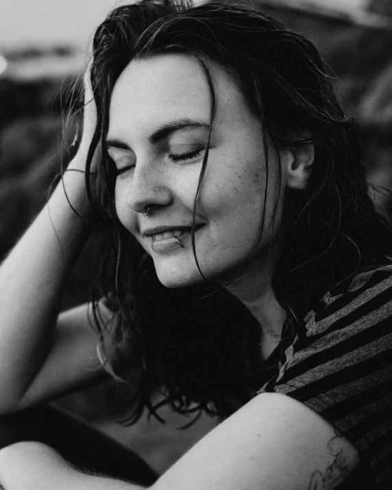 a black and white image of a girl with long hair