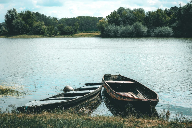 a small boat is pulled into the shore