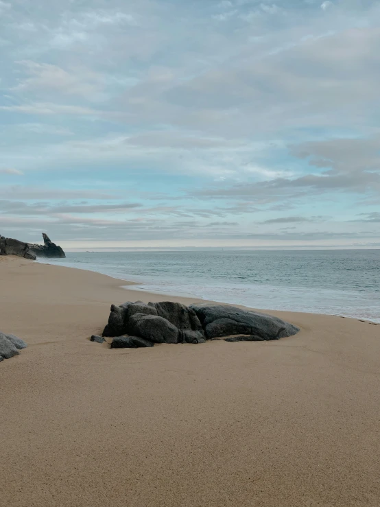 there is sand that has been washed up on the beach