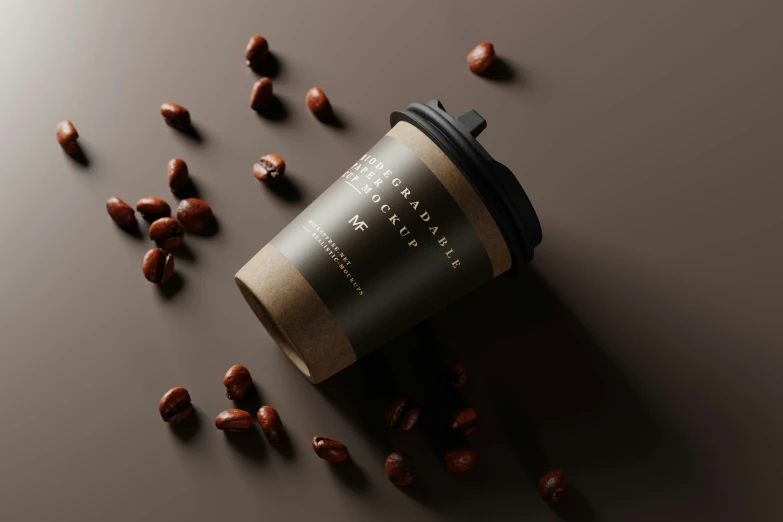 a coffee cup surrounded by beans on top of a table