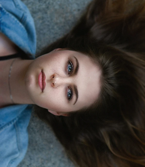 a close up of a person with long brown hair