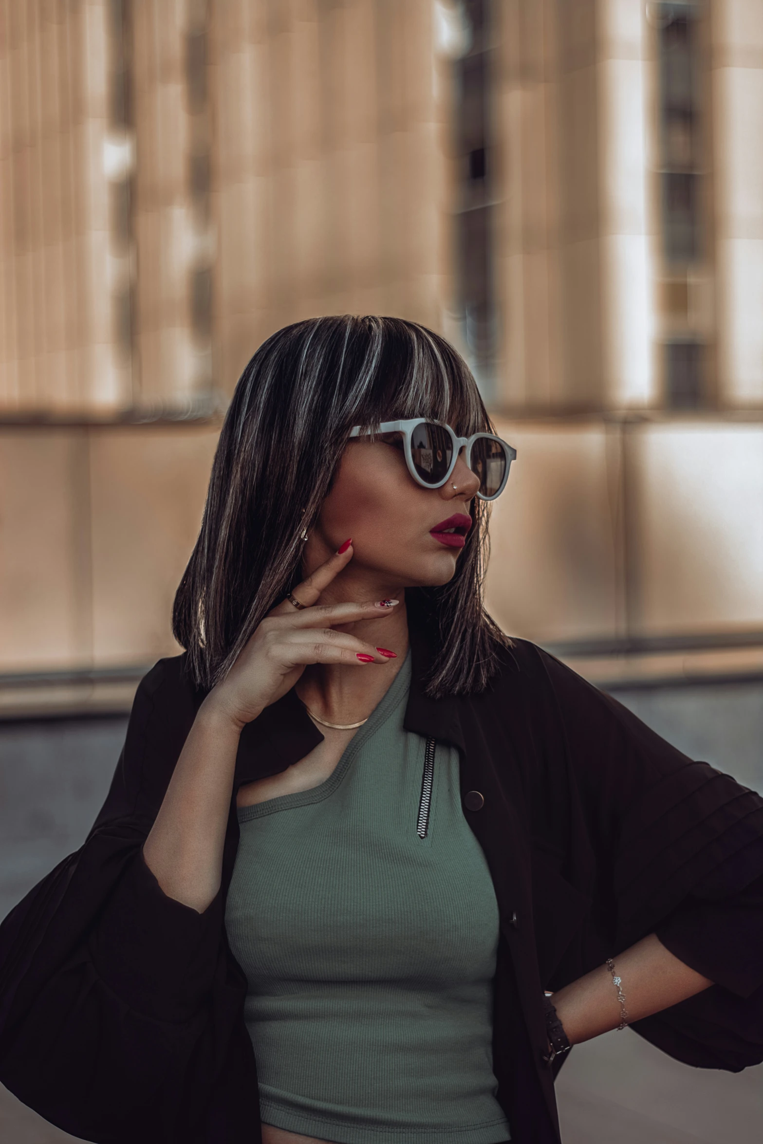 a woman in sunglasses talking on her cell phone