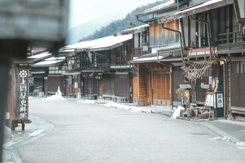 this is an image of some buildings in snow