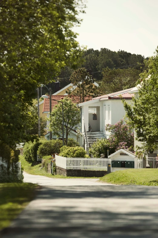 the front of a house with the trees around