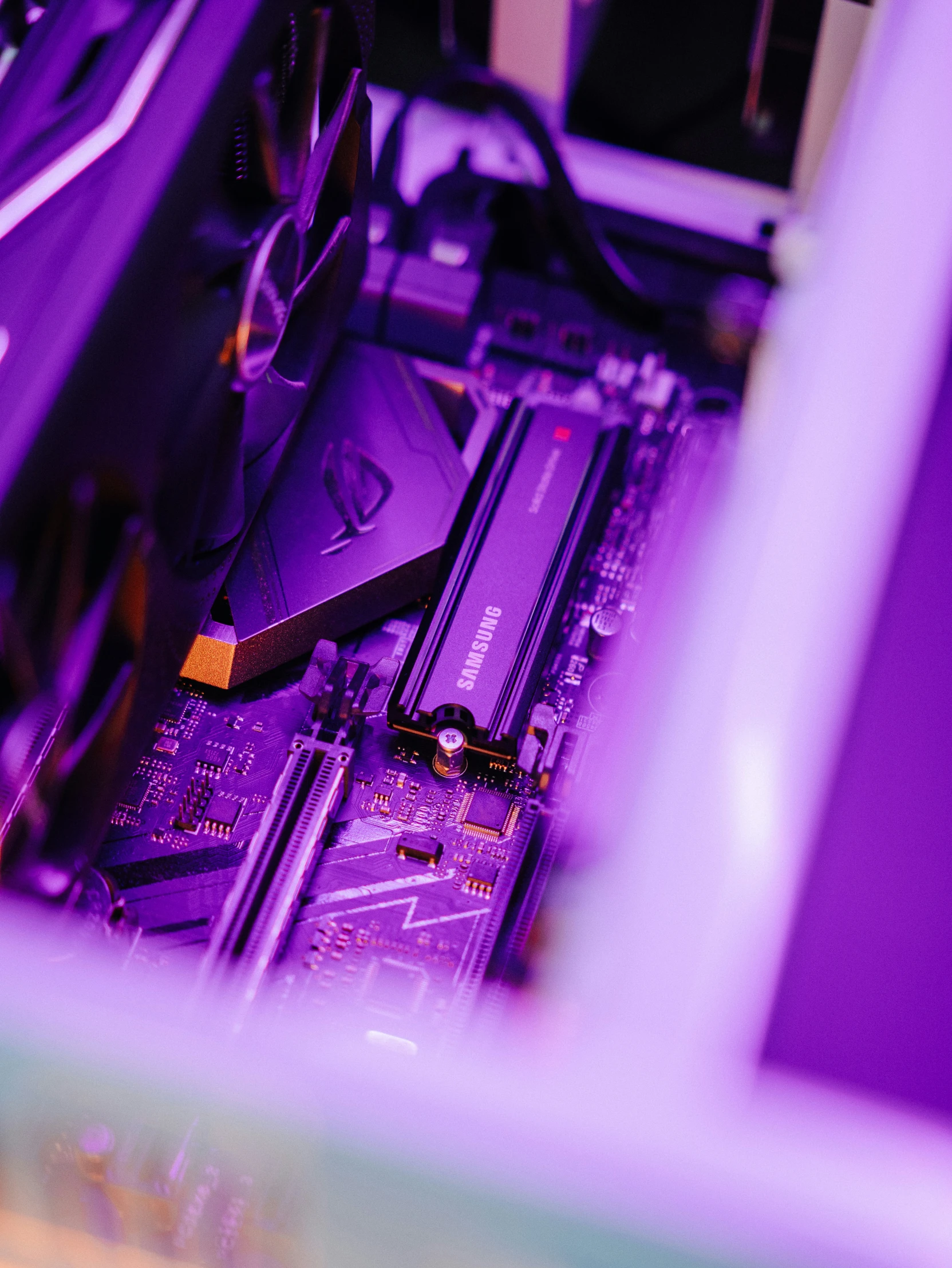 a motherboard and the board sitting in a very bright purple light