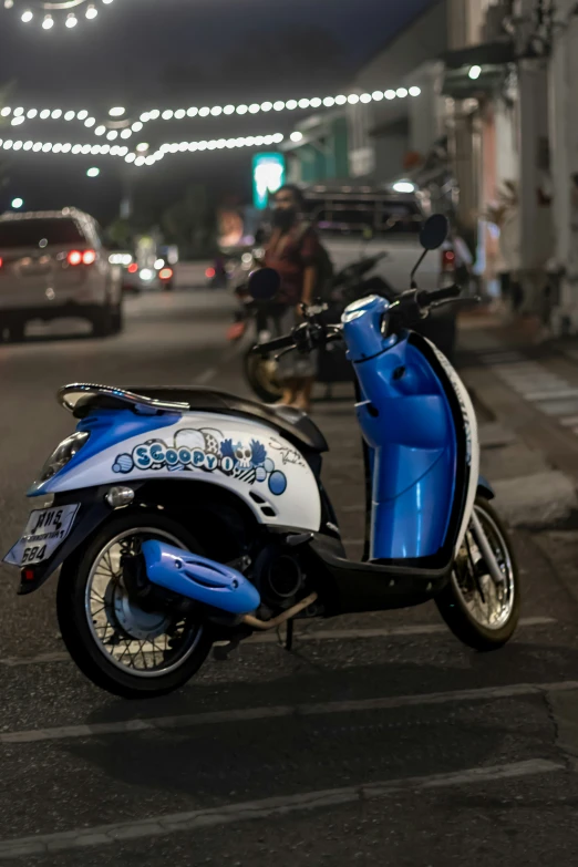 a parked scooter with a light that reads sesquitois on it