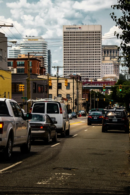 a street filled with lots of traffic near tall buildings