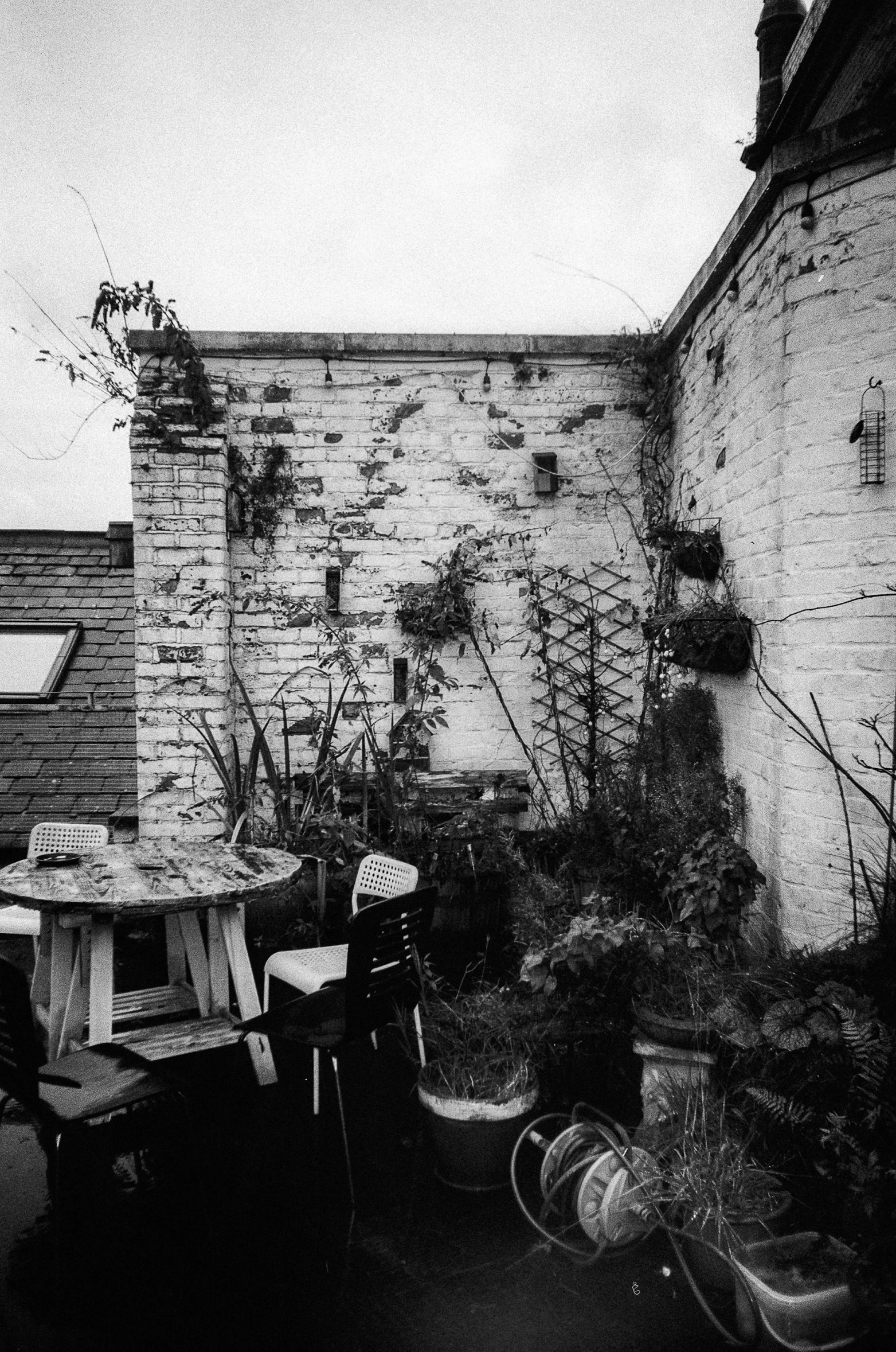 outdoor patio area with tables and chairs on cloudy day