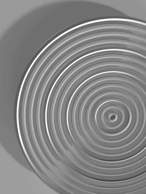 an abstract metal object with grey swirls and circles