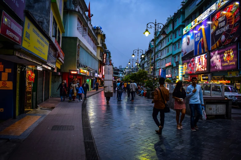 people walking through the streets in a shopping district