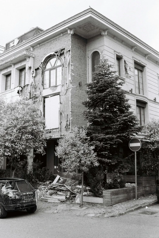 a very old building with lots of trees in front of it