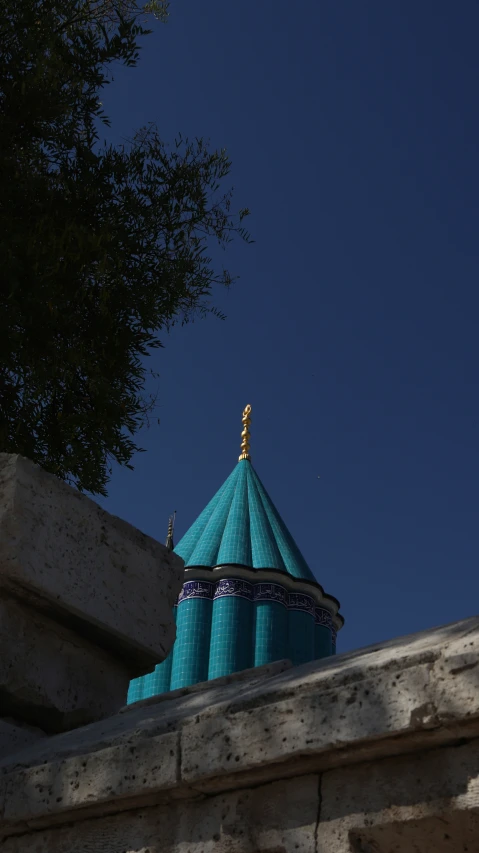 a blue dome with a tree on top