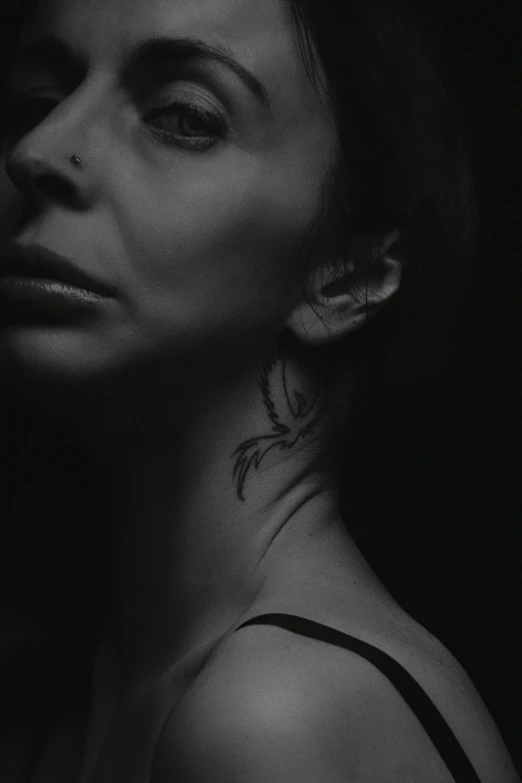 woman in black and white with dark background