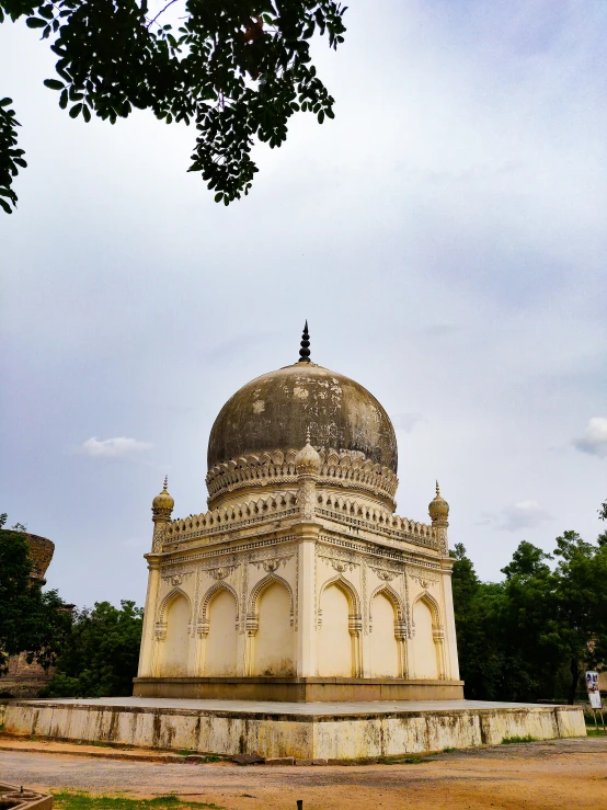 a tall and ornate white building with a dome