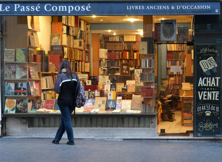 a bookstore that has people walking by