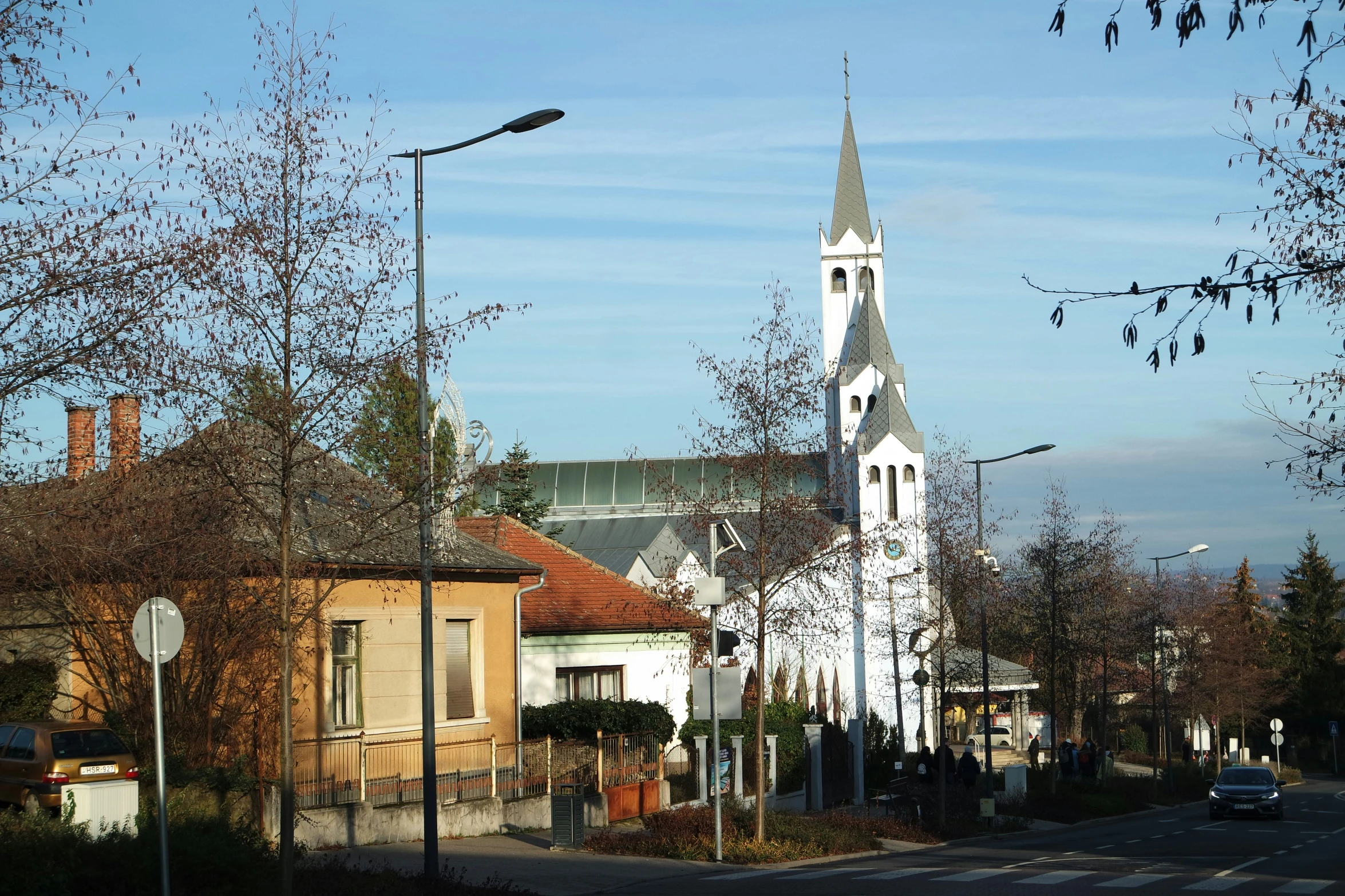 a church sitting on the side of the road