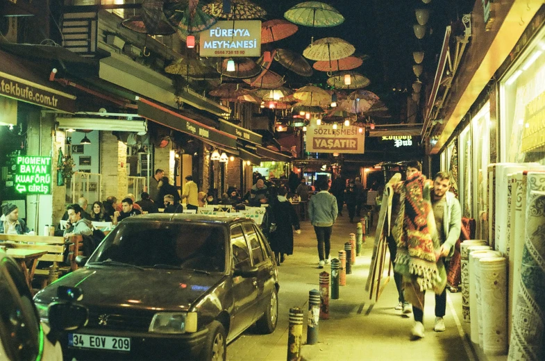 there is an outdoor cafe with umbrellas that cover the roof