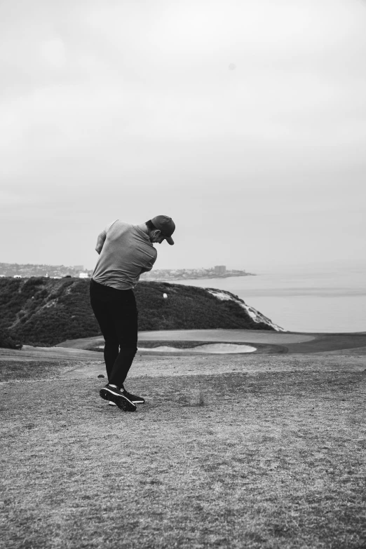 a man is doing a skateboard trick near the water