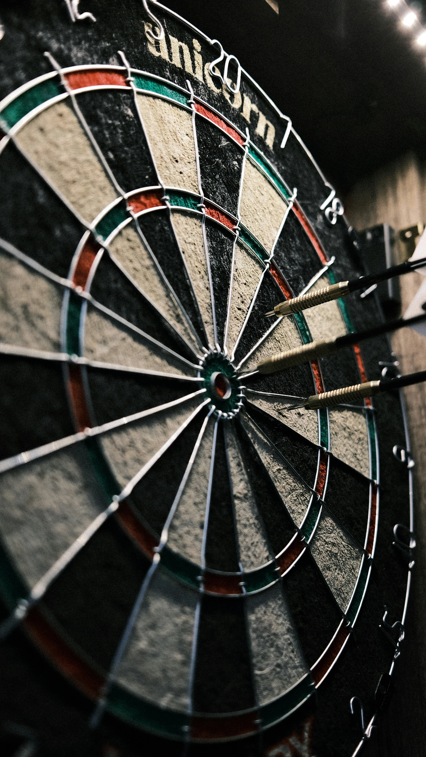 a closeup of the darts in a dart board