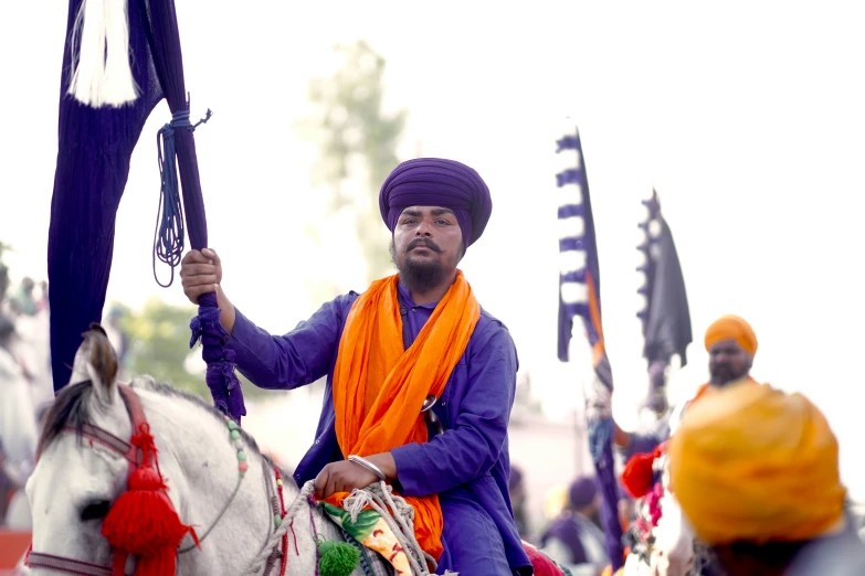 man on horseback with a costumed costume holding up a sword