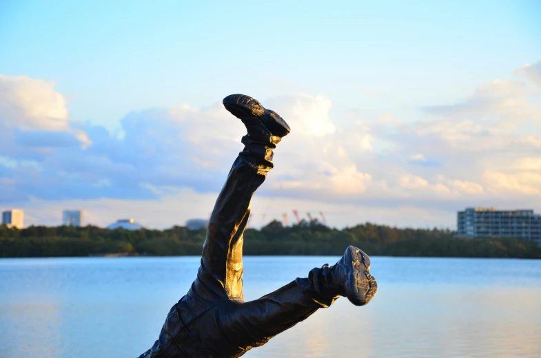 the statue has its foot up and it is upside down