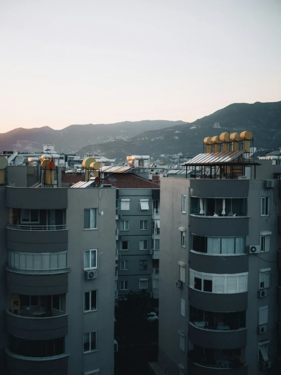 the rooftops of a city with apartment buildings next to them