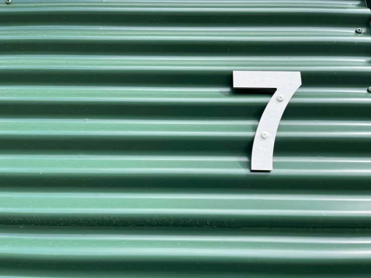 a white number seven on the side of a building