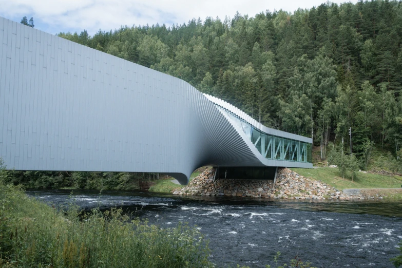 a bridge with green sides going over the water