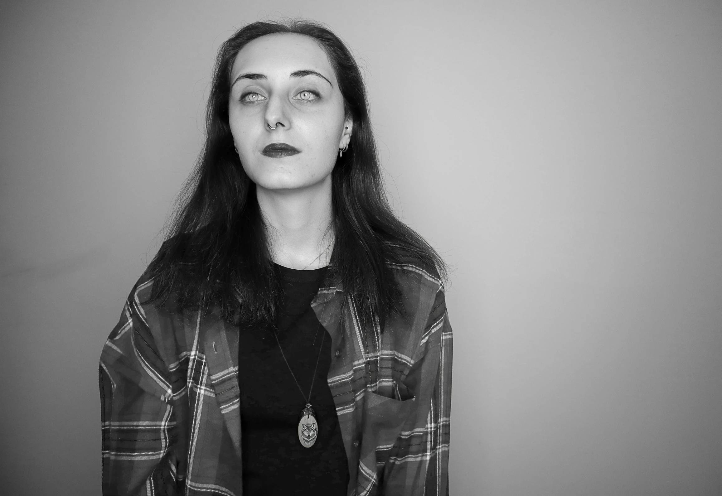 a woman with long hair posing for the camera