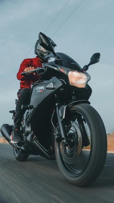 a person riding a motorcycle on the road