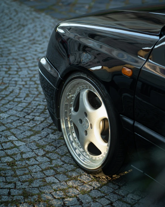 a closeup view of a shiny black sports car