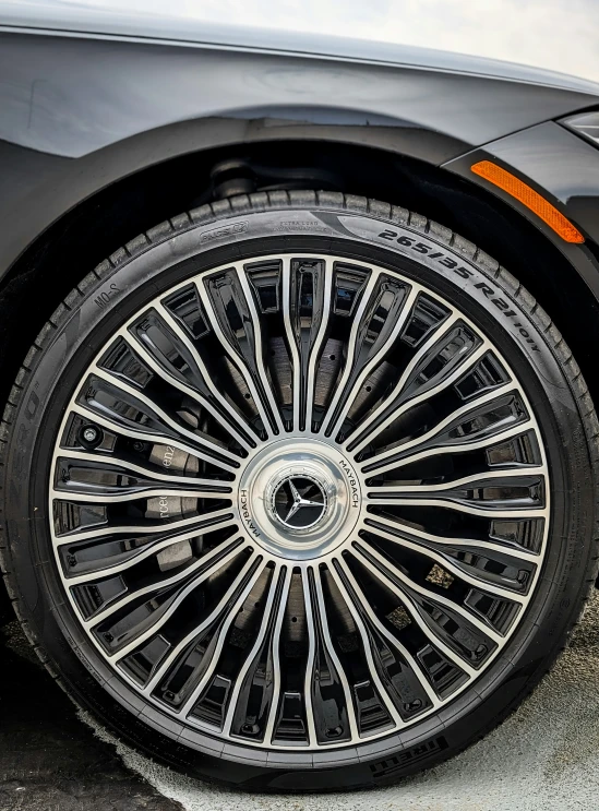 this car has large spokes and has black paint