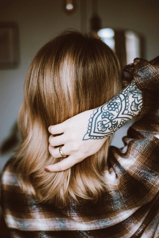 a girl with a tattoed arm and sleeve