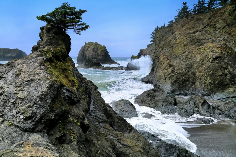 the view from behind the rocks shows rough sea water