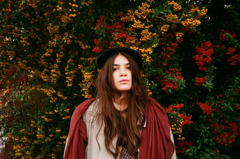 young adult female wearing red scarf posing for picture